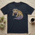 Dark t-shirt featuring a colorful illustration of a leopard gecko.