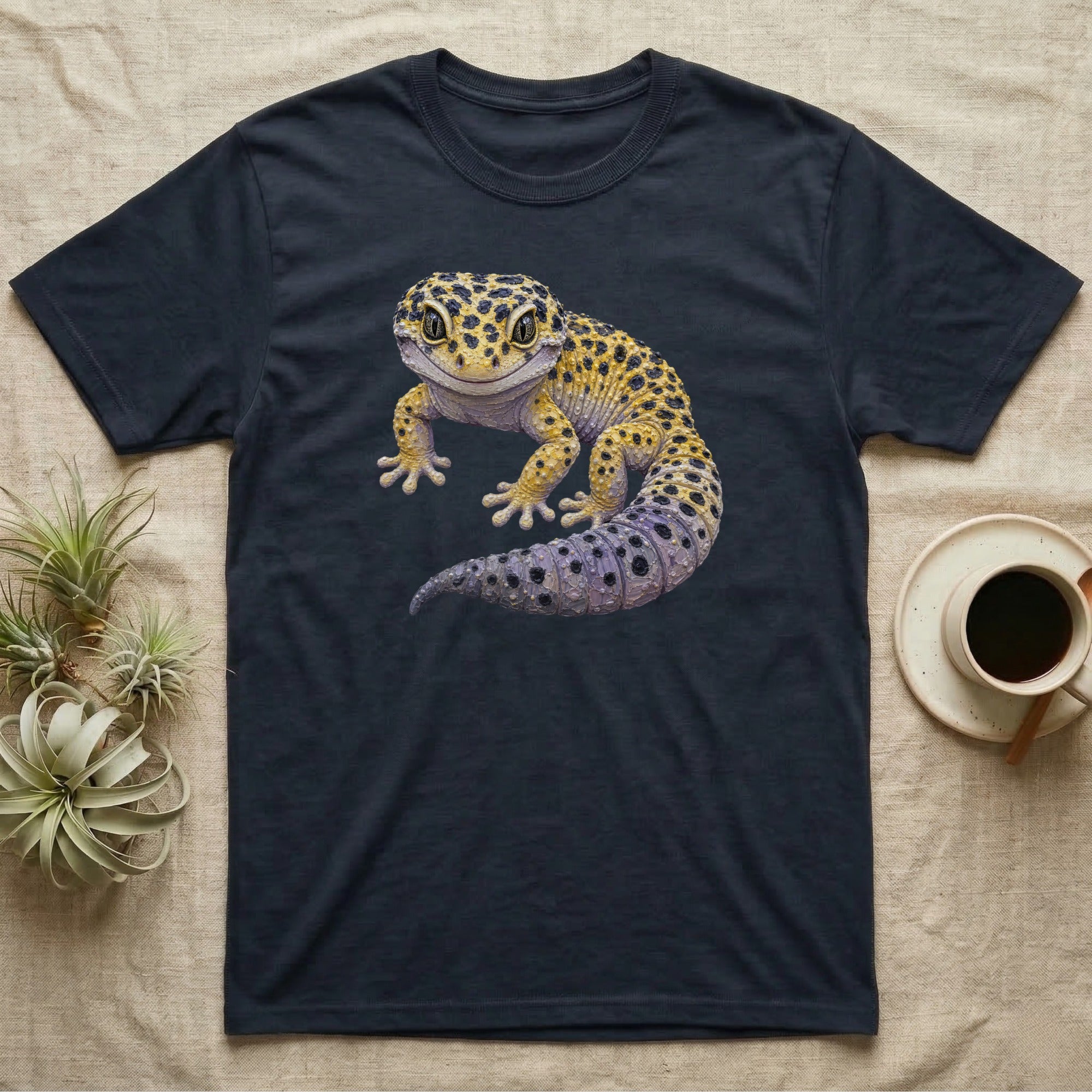 Dark t-shirt featuring a colorful illustration of a leopard gecko.