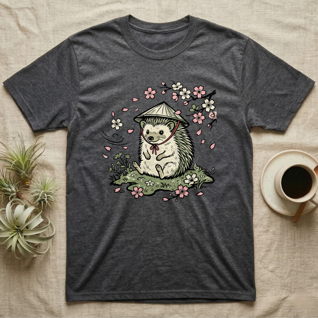Dark grey t-shirt with a smiling hedgehog wearing a conical hat under cherry blossoms.
