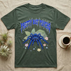 Cobalt Blue Tarantula Feral T-Shirt in Military Green — Cobalt blue tarantula with electric-blue legs under jagged cobalt metal text PRETTY BUT PSYCHO with pastel blossoms