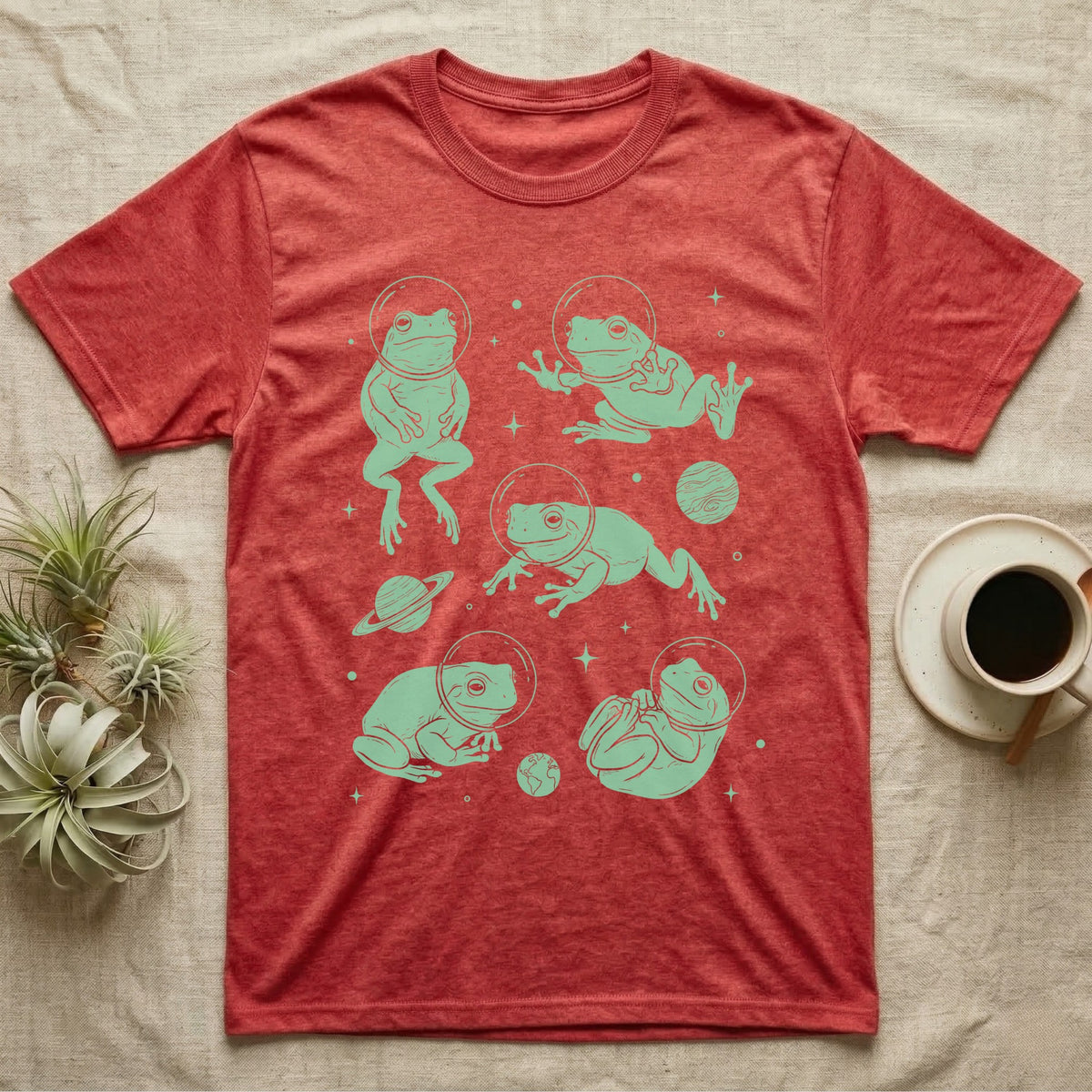 Whites Tree Frog Cosmic T-Shirt in Heather Red — Vintage screen-print illustration of White's tree frogs in astronaut helmets floating in space, cosmic jade green monochromatic on dark background.