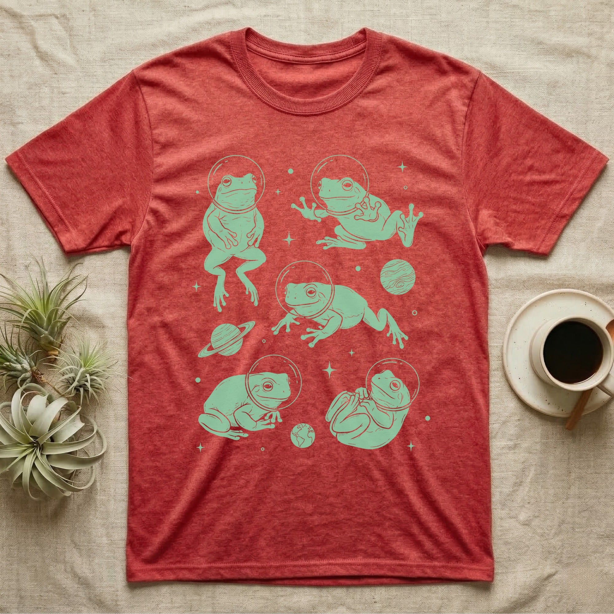 Whites Tree Frog Cosmic T-Shirt in Heather Red — Vintage screen-print illustration of White's tree frogs in astronaut helmets floating in space, cosmic jade green monochromatic on dark background.