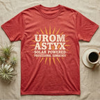 Solar Powered Uromastyx T-Shirt in Heather Red — Desert-poster wordmark reading "Uromastyx Solar Powered Professional Sunbather" with a small radiating sun motif.