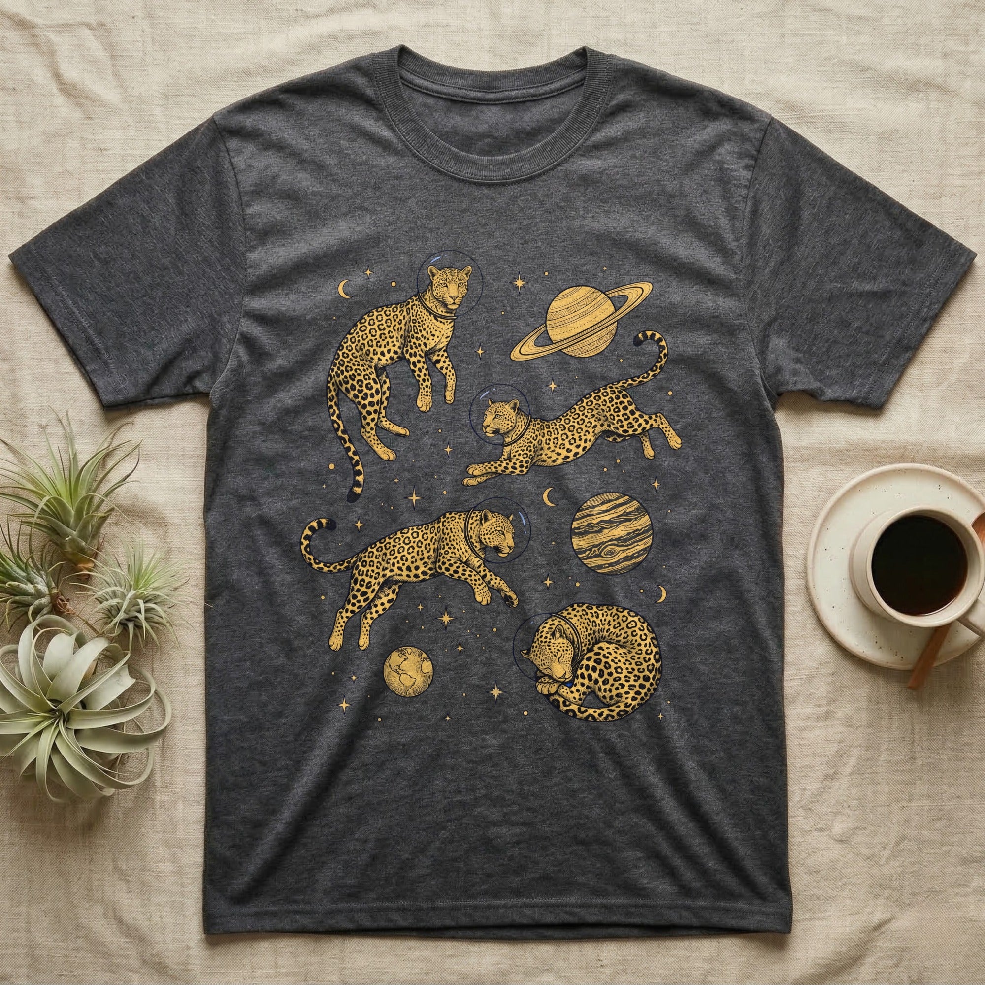 Dark grey t-shirt featuring leaping and sleeping cheetahs in space with planets and stars.
