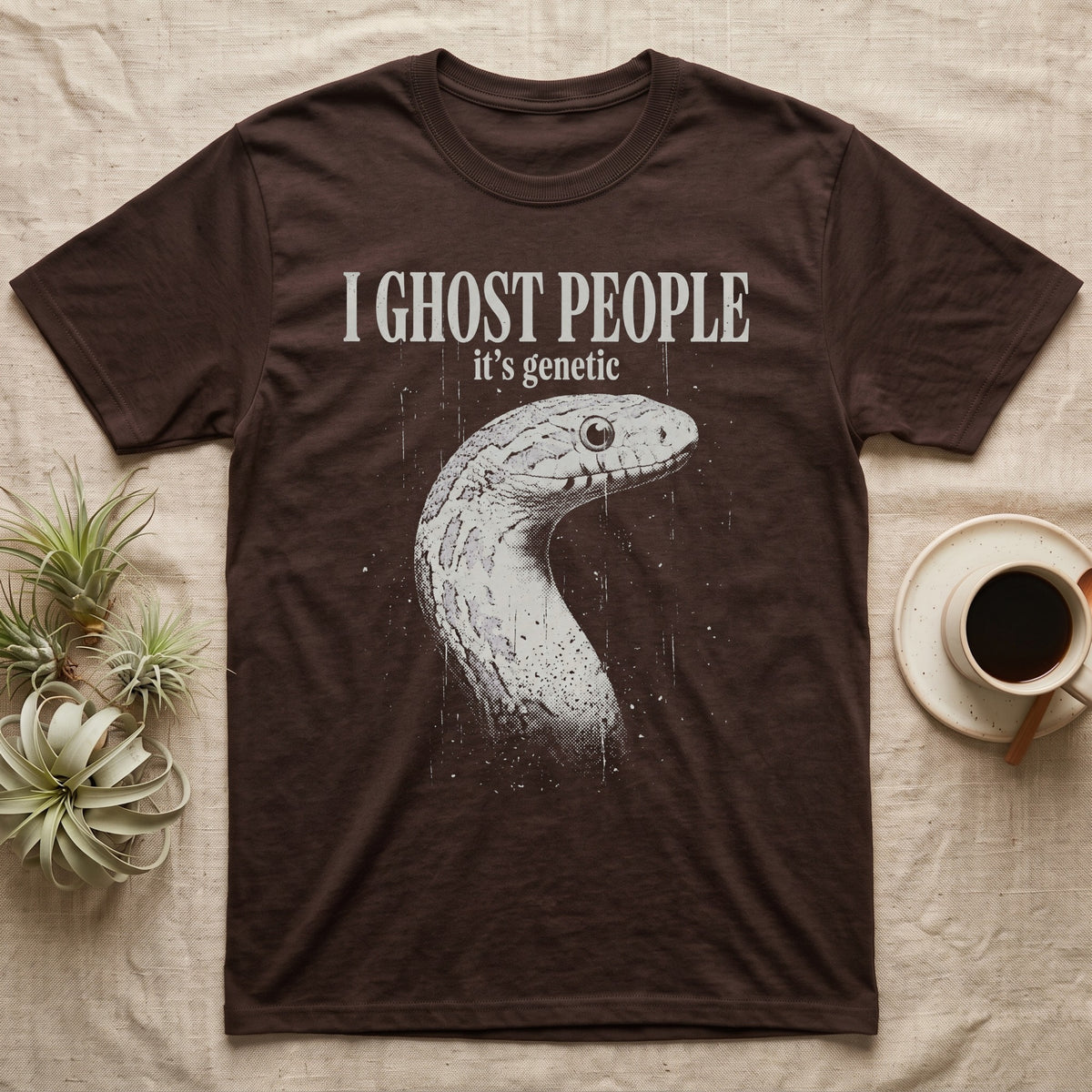 Ghost Corn Snake T-Shirt in Dark Chocolate — Gritty one-ink white print of a pale ghost corn snake head under the words I GHOST PEOPLE, it's genetic, on black