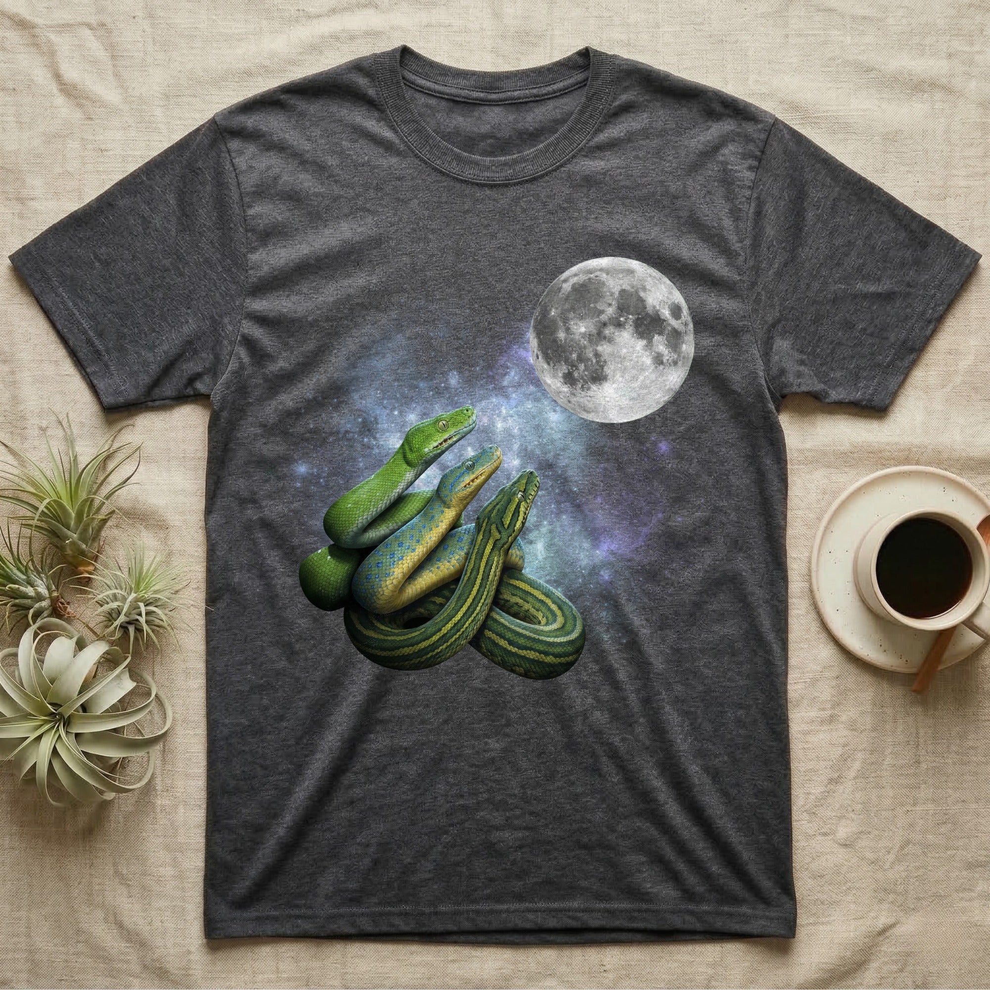 Green Tree Python Moon Howl T-Shirt in Dark Heather — Three Green Tree Python colour morphs howling at a full moon over a nebula on a dark grey t-shirt.