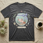 Dark gray t-shirt with a cartoon axolotl in a fishbowl and text that reads "soft & slimy & sweet".