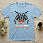 Tarantula Full-Size Bars T-Shirt in Light Blue — Black-and-orange tarantula holding two jack-o'-lantern buckets, "Give Me the Full-Size Bars Or the Hairs Get Flicked."