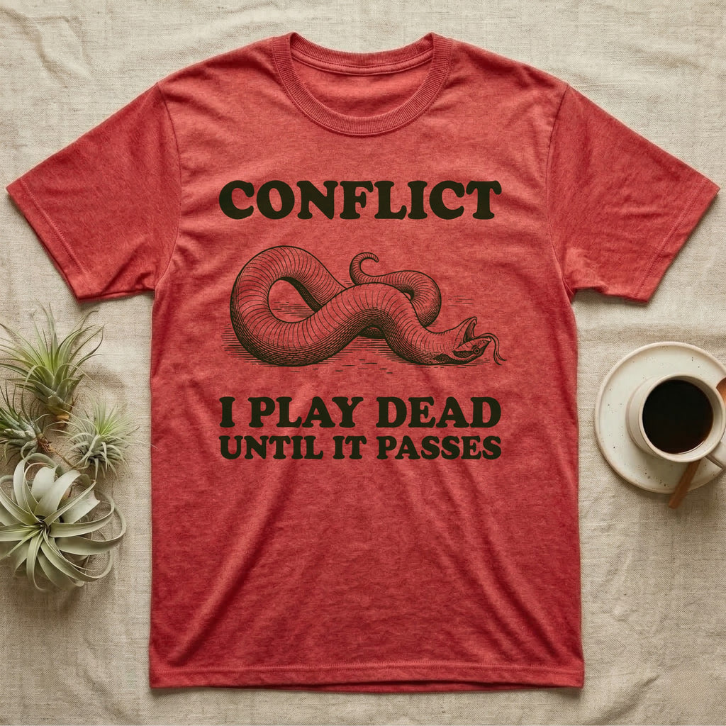 Hognose Conflict T-Shirt in Heather Red — Engraved western hognose snake twisted over and playing dead with its tongue out, between the words CONFLICT and I PLAY DEAD UNTIL IT PASSES.