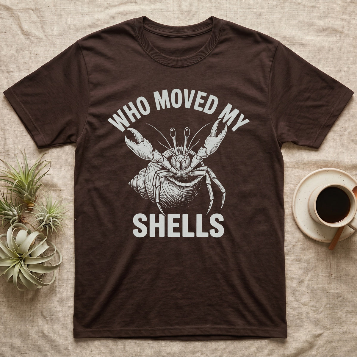 Hermit Crab Outrage T-Shirt in Dark Chocolate — White-line engraving of a hermit crab flinging both claws up under the words Who Moved My Shells