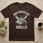 Hermit Crab Outrage T-Shirt in Dark Chocolate — White-line engraving of a hermit crab flinging both claws up under the words Who Moved My Shells