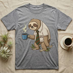 Grey t-shirt with graphic of a tired sloth holding a coffee mug.