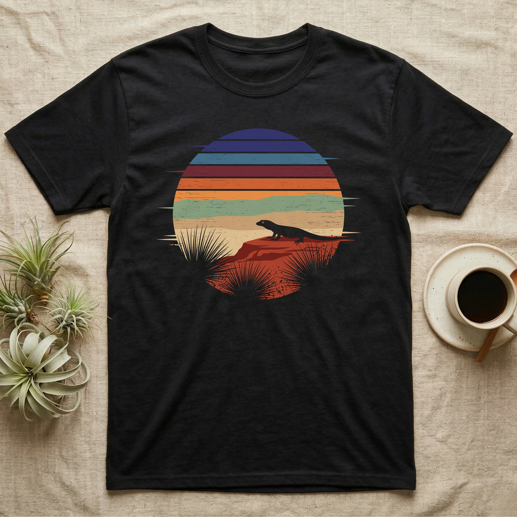 Ackie Monitor Night Window T-Shirt in Black — Ackie monitor silhouetted on red rock inside a broken circular window of flat stepped desert night colour bands.