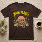 Hognose Toad Reaper T-Shirt in Dark Chocolate — Realistic western hognose coiled in a loaf between two cartoon toads under jagged yellow lettering: TOAD REAPER