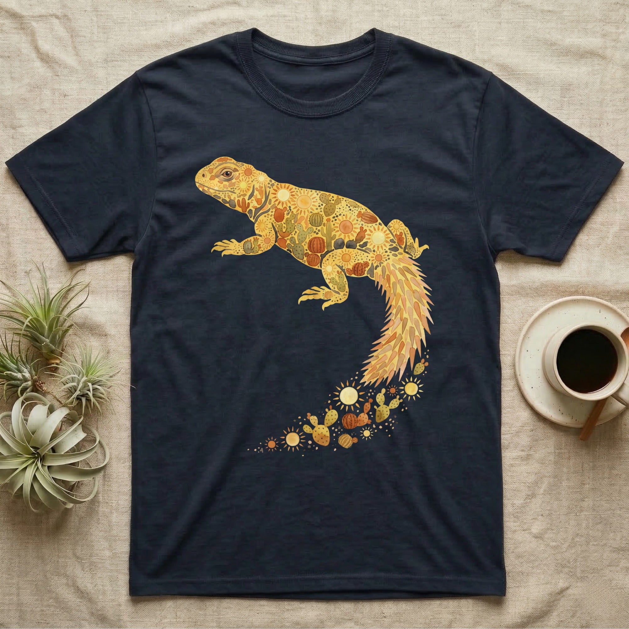 Uromastyx Solar Loaf T-Shirt in Navy — Warm watercolour mosaic of a basking uromastyx lizard made of tiny suns, cacti and sand on grey