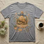 Leopard gecko in a terrarium on a grey t-shirt with "Home is here" tag.