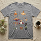 Bearded Dragon Halloween Sampler T-Shirt in Sport Grey — Gouache sampler of ten bearded dragon Halloween vignettes — pumpkin costume, witch hat, red cape — on dark charcoal.