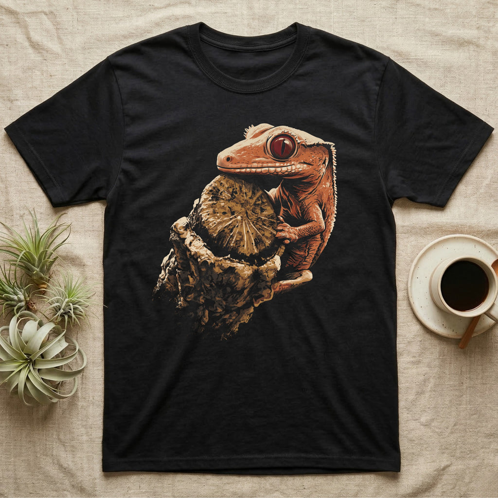 Illustration of a crested gecko gripping a weathered wooden stump in warm coral and terracotta tones, bold vintage-comic ink outlines, graphic-only, no text. — shown on a Black tee.