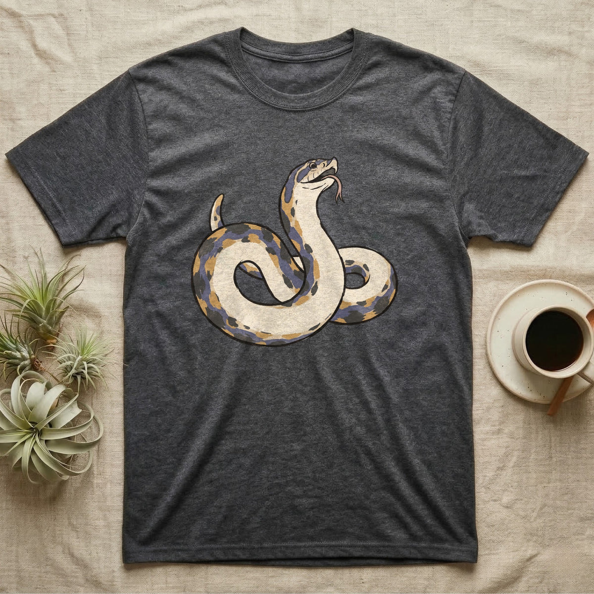 Hognose Play Dead T-Shirt in Dark Heather — Ukiyo-e woodblock illustration of a western hognose snake playing dead belly-up with a deadpan serif caption beneath.