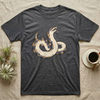 Hognose Play Dead T-Shirt in Dark Heather — Ukiyo-e woodblock illustration of a western hognose snake playing dead belly-up with a deadpan serif caption beneath.
