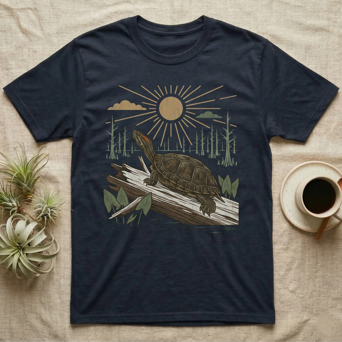 Red-Eared Slider Home Range T-Shirt in Navy — Woodcut-style illustration of a red-eared slider basking on a half-sunk log in a cypress swamp under a full sun, no on-shirt text.