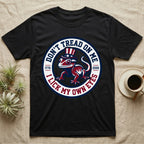 Crested Gecko 1776 T-Shirt in Black — Distressed crest of a crested gecko in a top hat with text Don't Tread On Me and I Lick My Own Eyes.