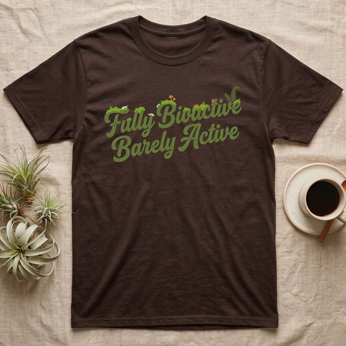 Bioactive Terrarium Moss T-Shirt in Dark Chocolate — Retro script reading Fully Bioactive overgrown with moss, isopods and mushrooms, above bare lettering reading Barely Active