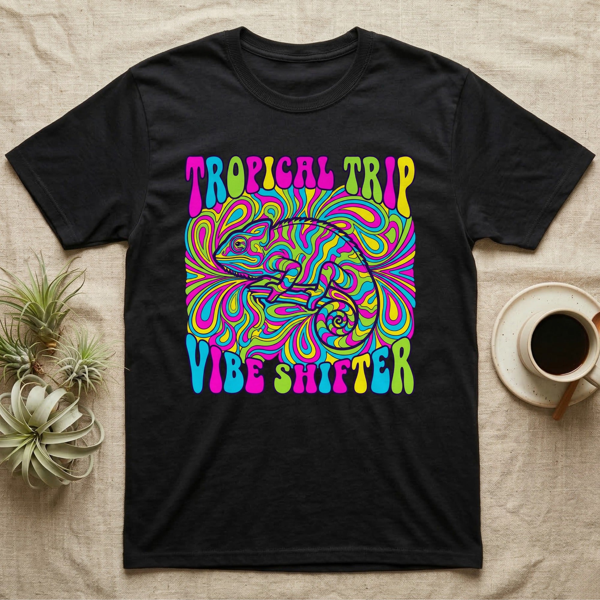 Black t-shirt with psychedelic "Tropical Trip Vibe Shifter" text and chameleon graphic.