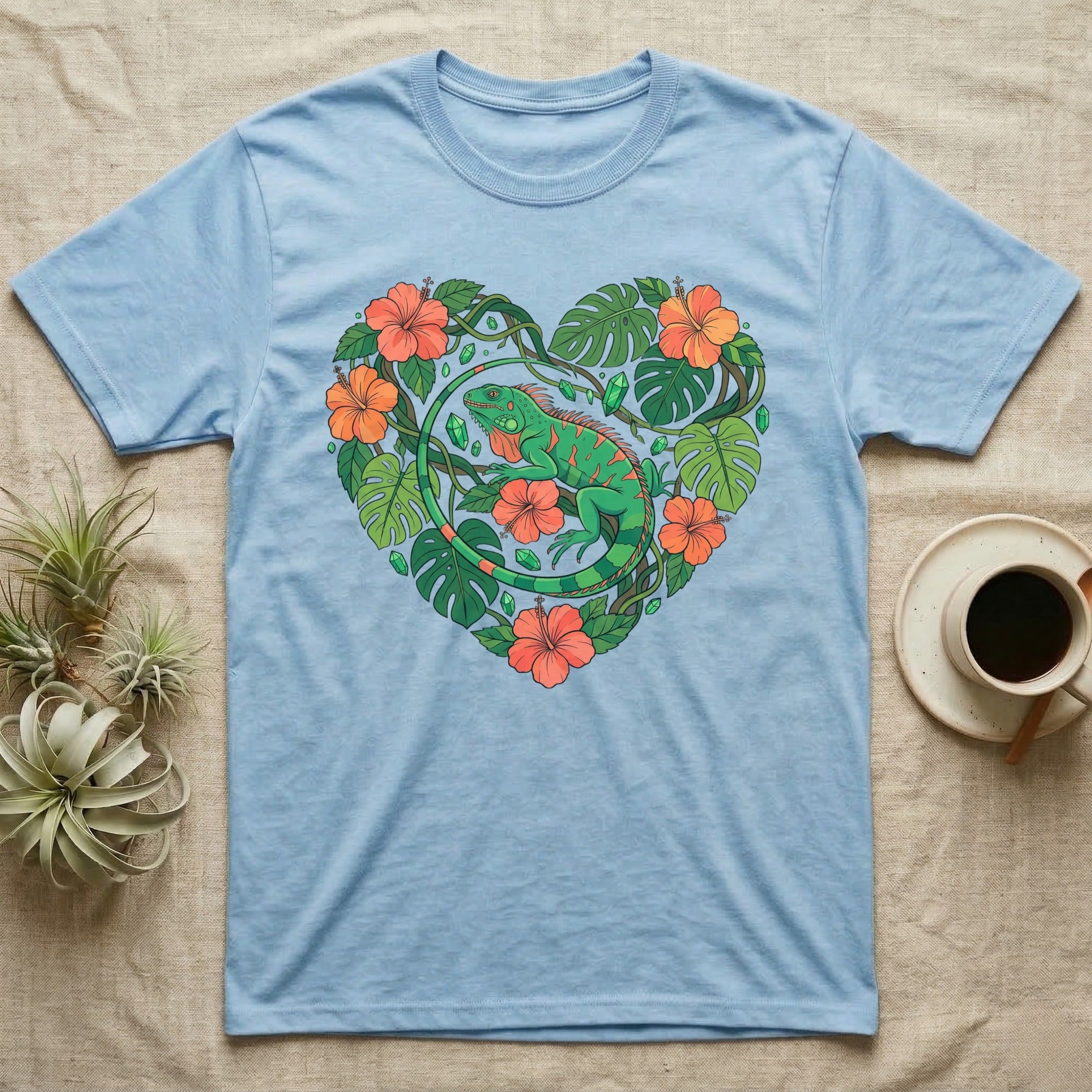 Light blue t-shirt with a green iguana and tropical flowers forming a heart.