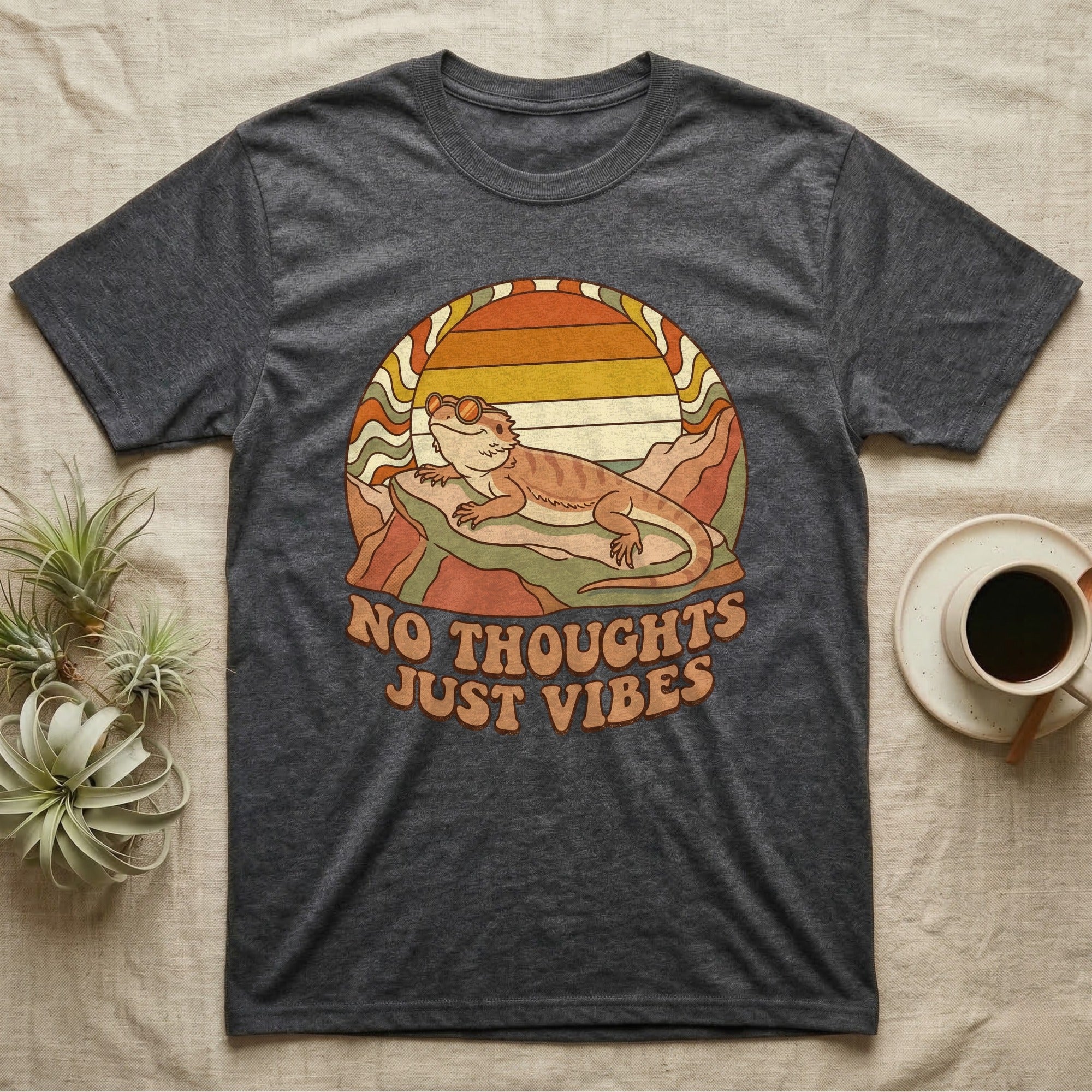 Dark grey t-shirt with a bearded dragon and "NO THOUGHTS JUST VIBES" text.