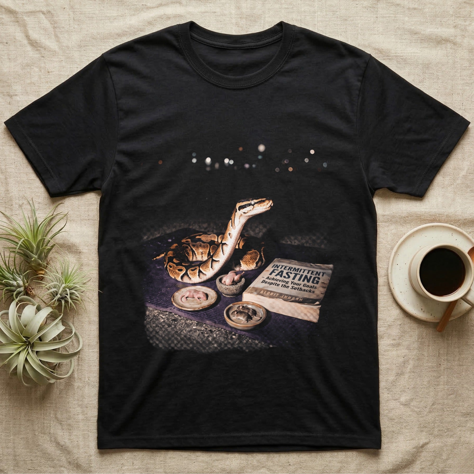 Black t-shirt with a Ball Python and "Intermittent Fasting" book.