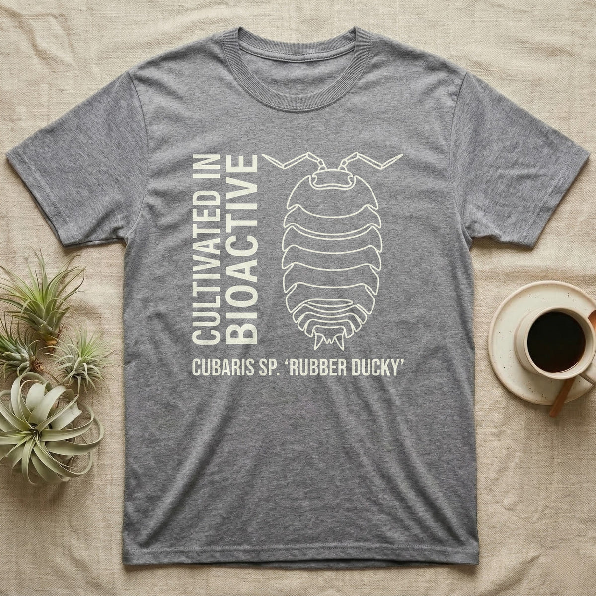 Rubber Ducky Isopod Line Art T-Shirt in Sport Grey — Bone-white outline drawing of a rubber ducky isopod labelled Cubaris sp. beside vertical stencil type.