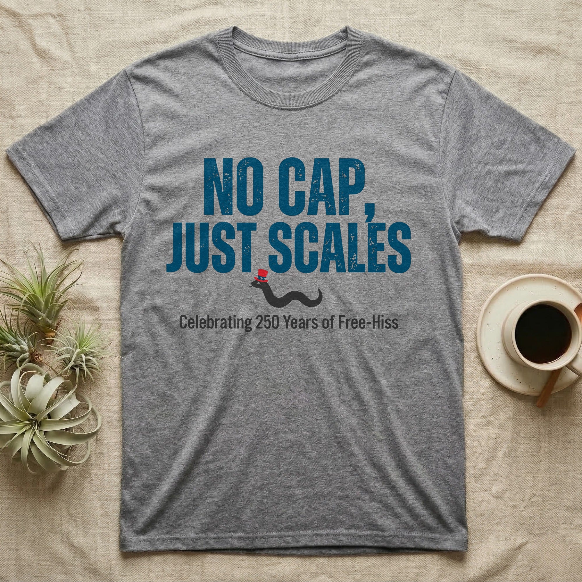 Rattlesnake No Cap T-Shirt in Sport Grey — Big distressed text No Cap Just Scales over a tiny snake in a red top hat with 250 Years of Free-Hiss below.