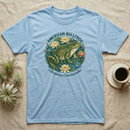 Light blue t-shirt featuring an American Bullfrog illustration surrounded by lily pads and flowers.