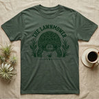Sulcata Tortoise Under Lawn T-Shirt in Military Green — Engraved sulcata tortoise in white line, head down and legs braced mid-dig, under retro script reading UNDER THE LAWN.