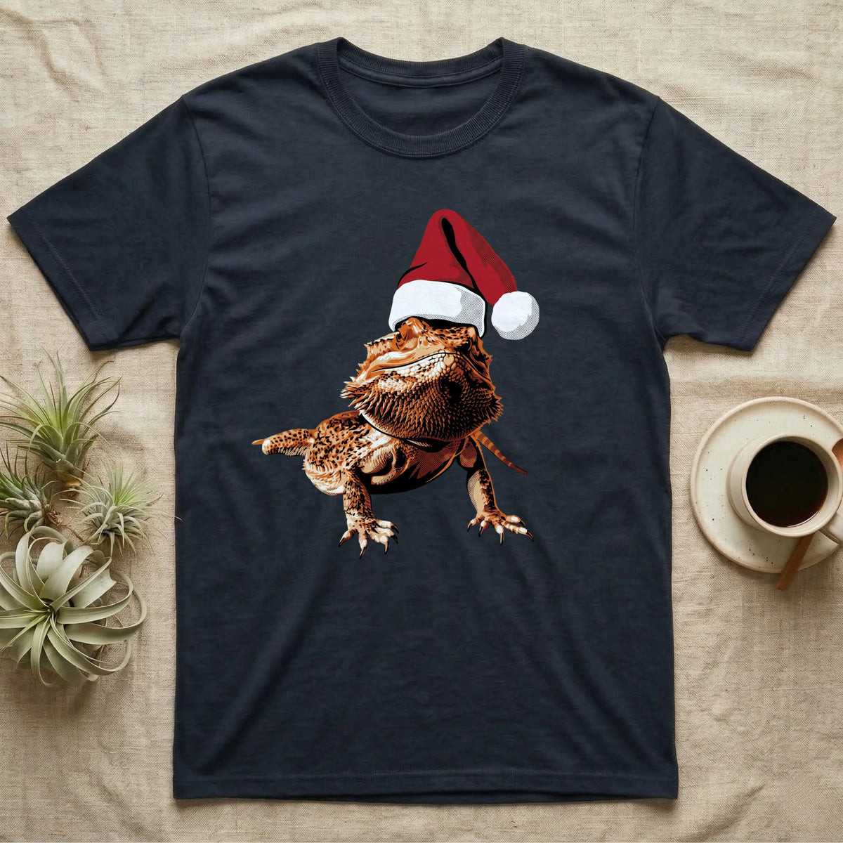 Vintage comic illustration of a bearded dragon wearing a red and white Santa hat, graphic-only, no text. — shown on a Navy tee.