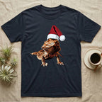Vintage comic illustration of a bearded dragon wearing a red and white Santa hat, graphic-only, no text. — shown on a Navy tee.