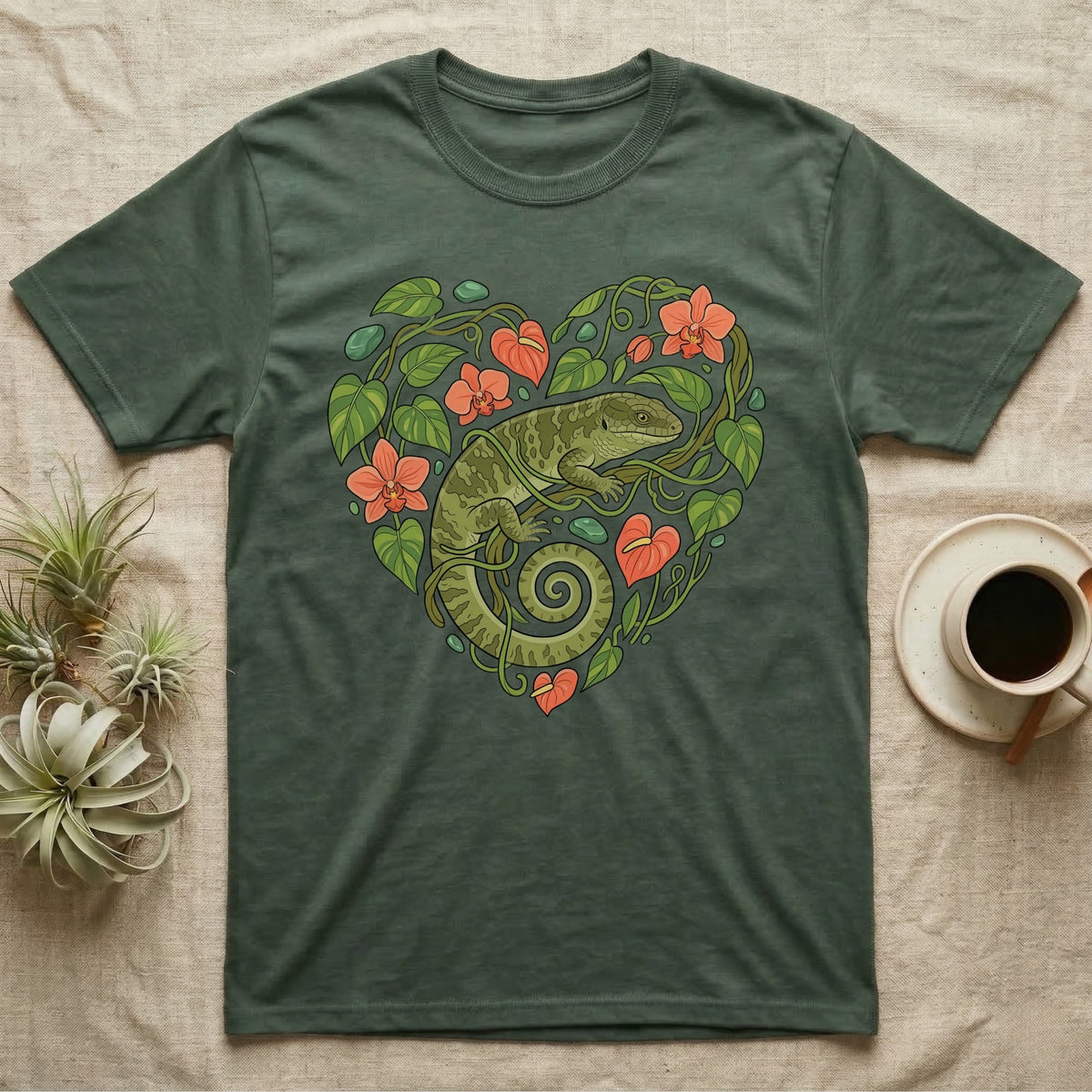 Green t-shirt with a lizard and floral heart design.