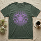 Vampire Crab Folk Medallion T-Shirt in Military Green — Violet woodblock vampire crab seen face-on, its raised claws cut into a contained folk sunburst medallion.