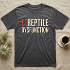 E-Reptile Dysfunction Gecko T-Shirt in Dark Heather — Retro-pharmacy typographic wordmark reading "E-Reptile Dysfunction" in distressed cream and tomato-red lettering.