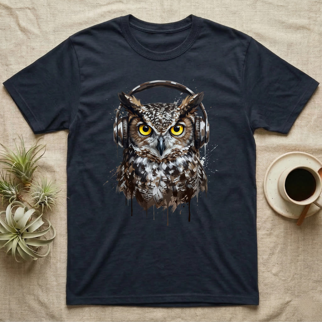 Dark t-shirt with graphic of an owl wearing headphones, coffee cup and plants nearby.
