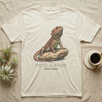 Beige t-shirt with illustration of a bearded dragon on a rock.