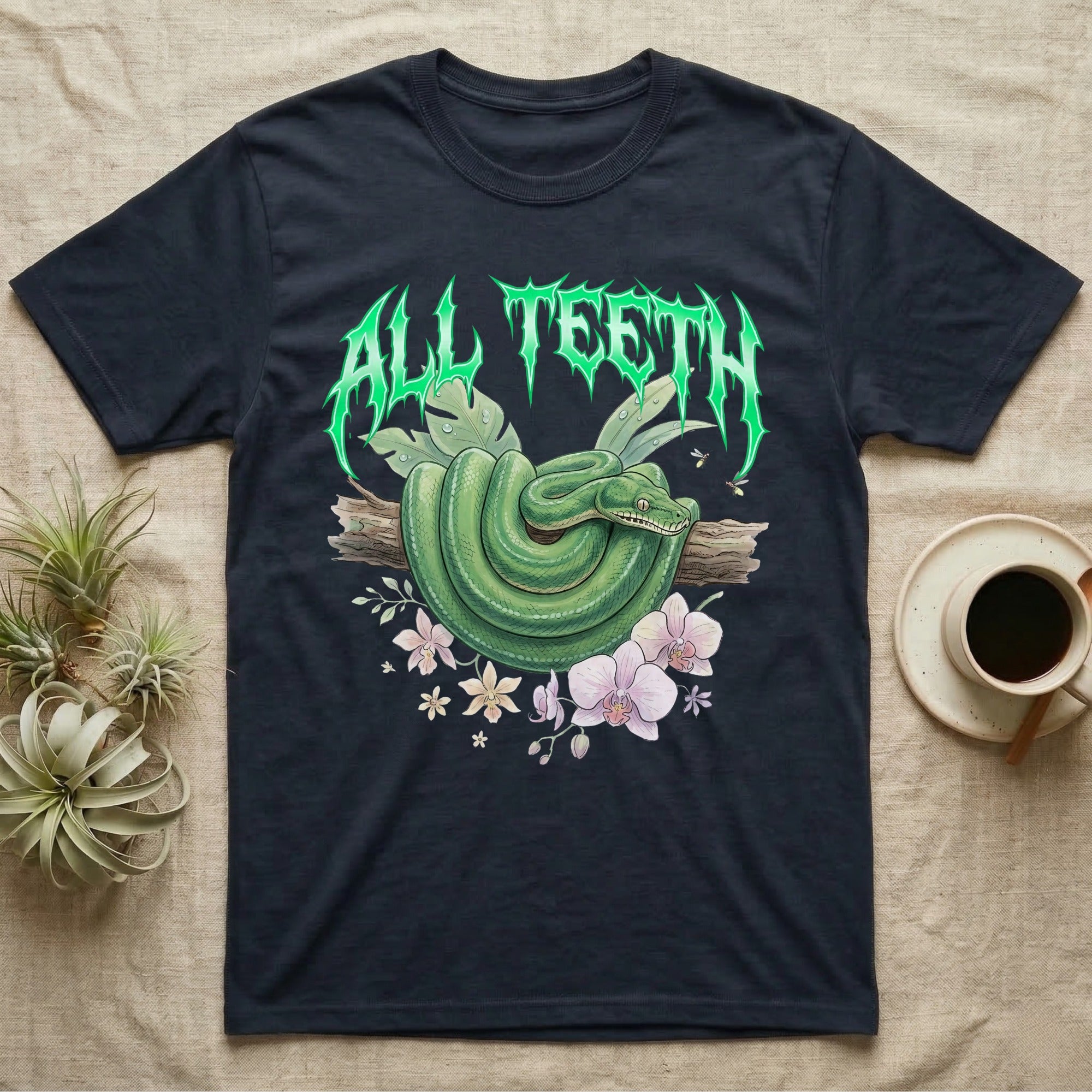 Emerald Tree Boa Feral T-Shirt in Navy — Coiled emerald tree boa on a branch below a dripping emerald-green metal "All Teeth" wordmark