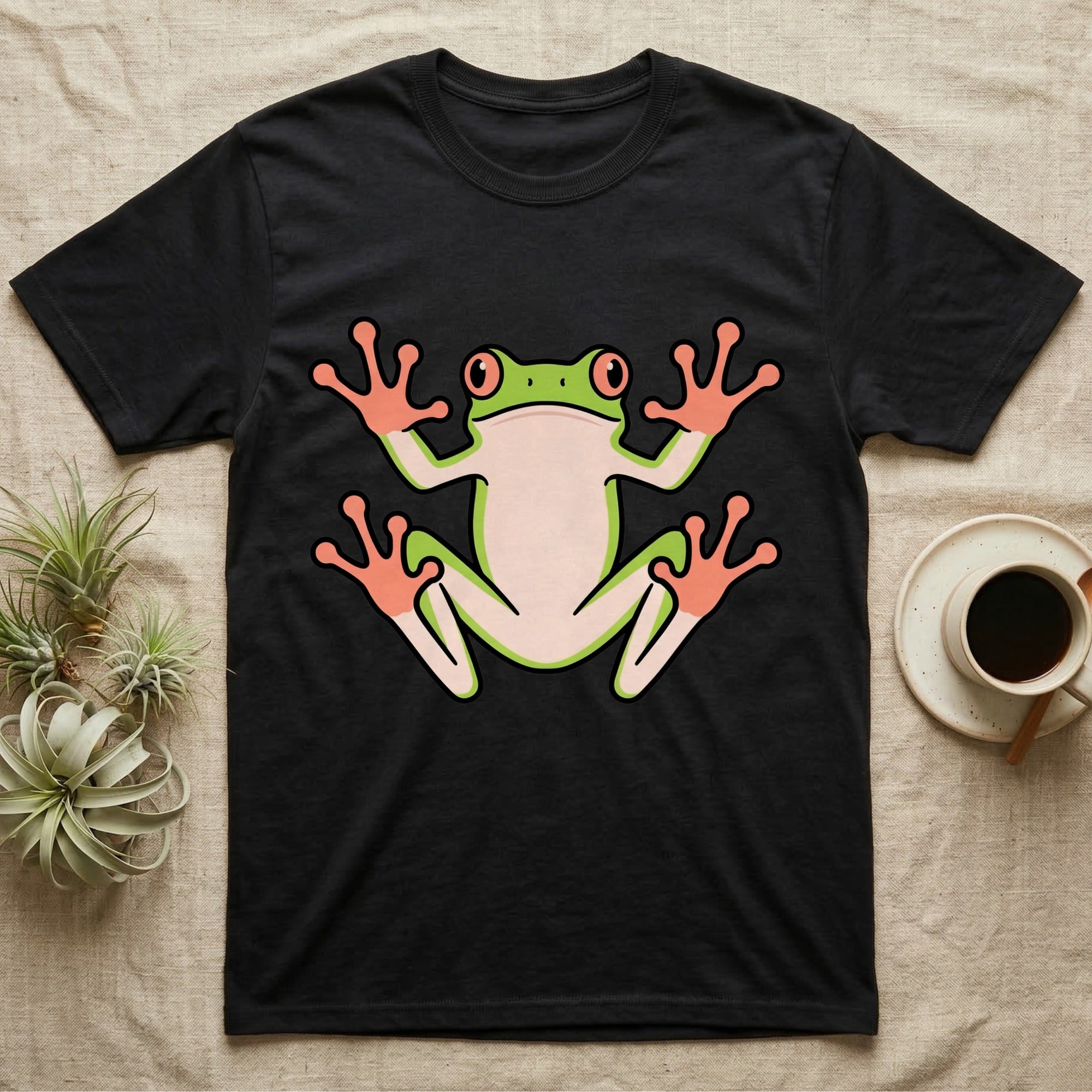 Tree Frog On Glass T-Shirt in Black — Vector-bold tree frog plastered against implied glass, suction feet splayed wide, small "Tree Frog On Glass." caption.