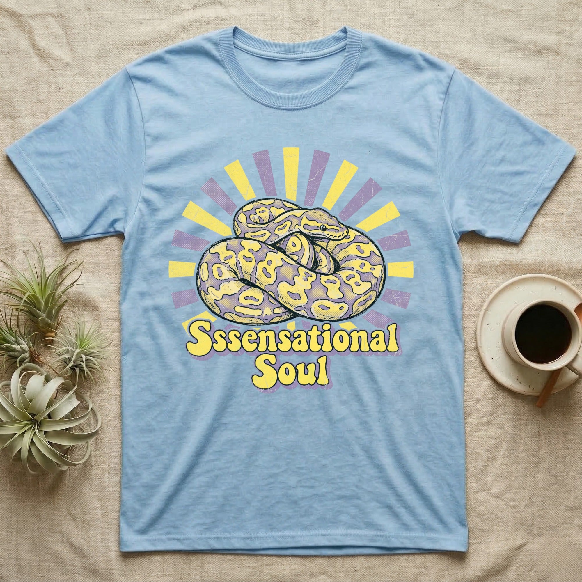 Light blue t-shirt with coiled snake and "Ssensational Soul" text.