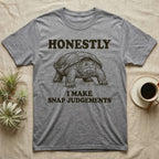 Snapping Turtle Judgements T-Shirt in Sport Grey — Engraved snapping turtle standing, head forward, with the words Honestly, I Make Snap Judgements