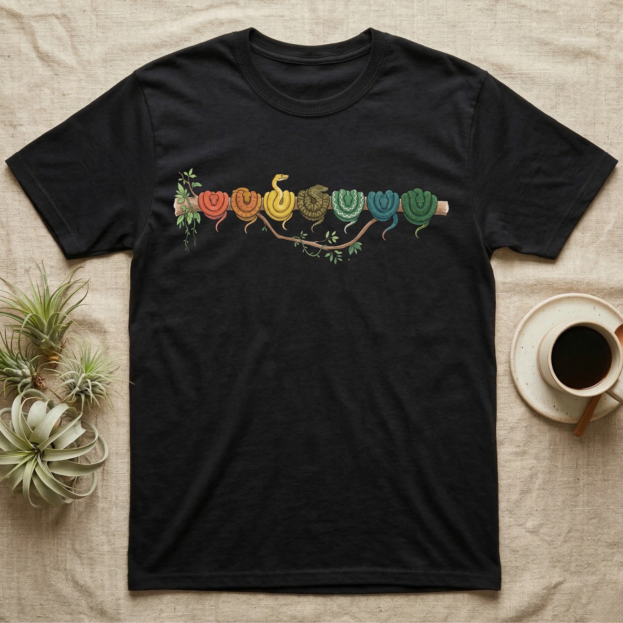 Emerald Tree Boa Canopy Crew T-Shirt in Black — Watercolor illustration of seven emerald tree boas in real colour stages coiled on a branch, dark grey T-shirt design.