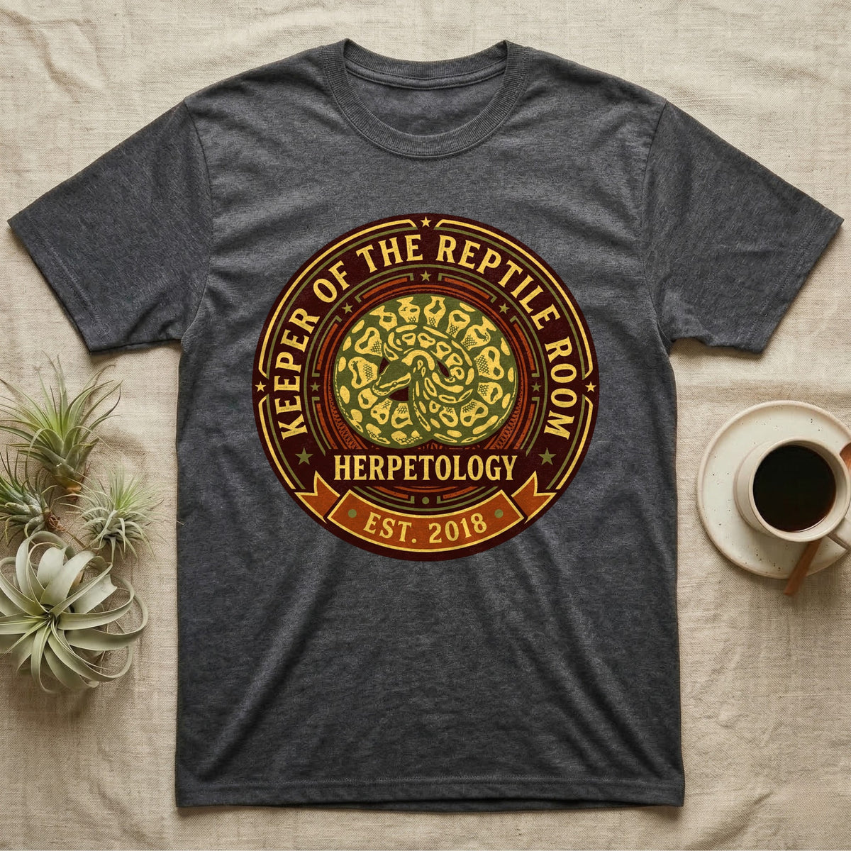 Dark gray t-shirt with a circular "Keeper of the Reptile Room" graphic.