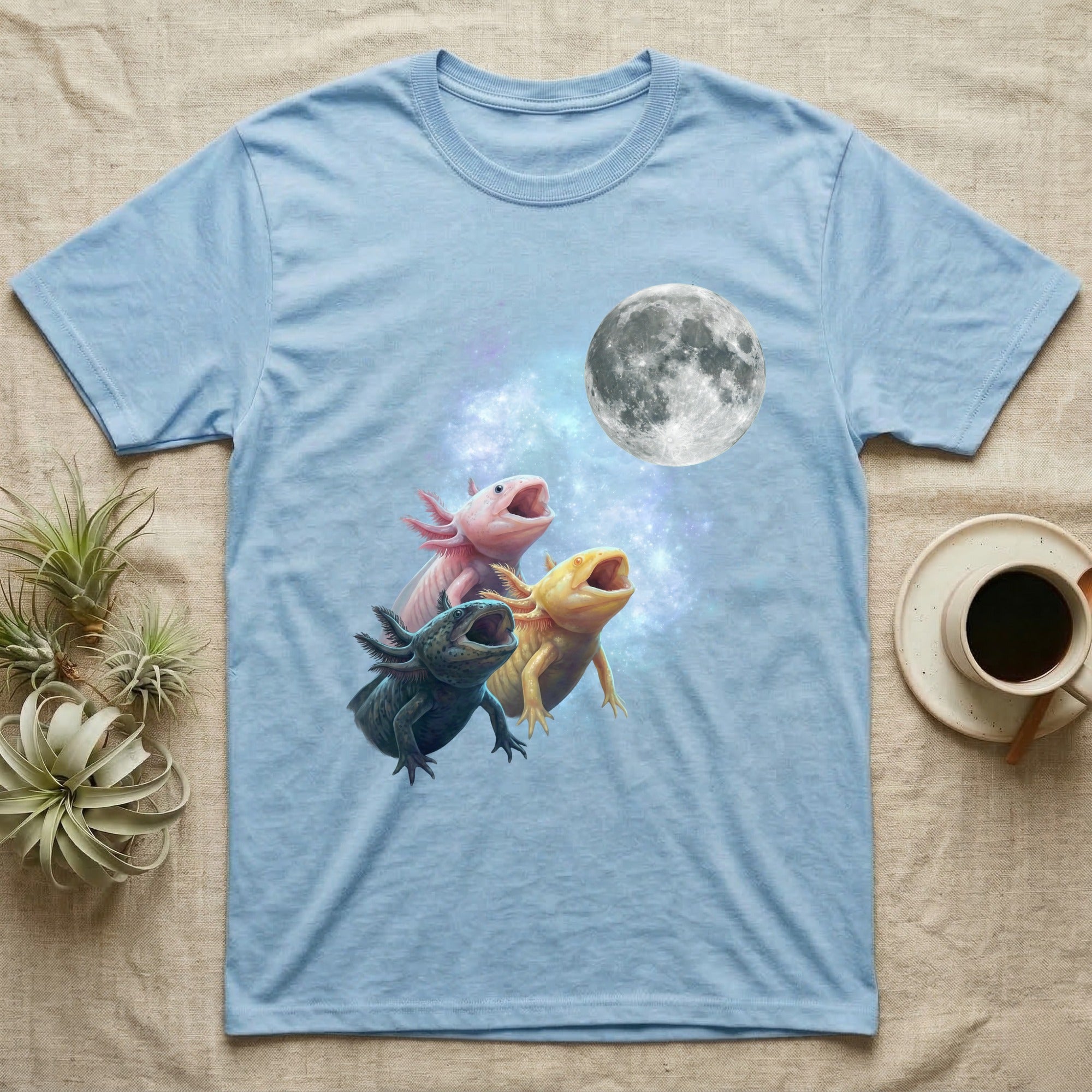 Axolotl Moon Howl T-Shirt in Light Blue — Three Axolotl colour morphs howling at a full moon over a nebula on a dark grey t-shirt.