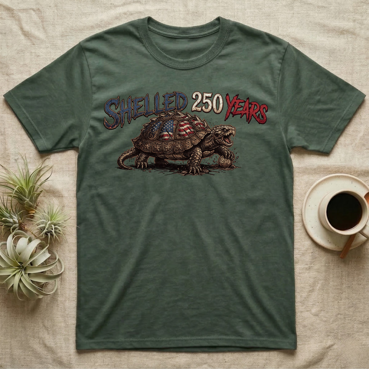 Snapping Turtle 250 T-Shirt in Military Green — Gritty woodcut alligator snapping turtle with a flag-etched shell on a 250 coin under text Shelled 250 Years.